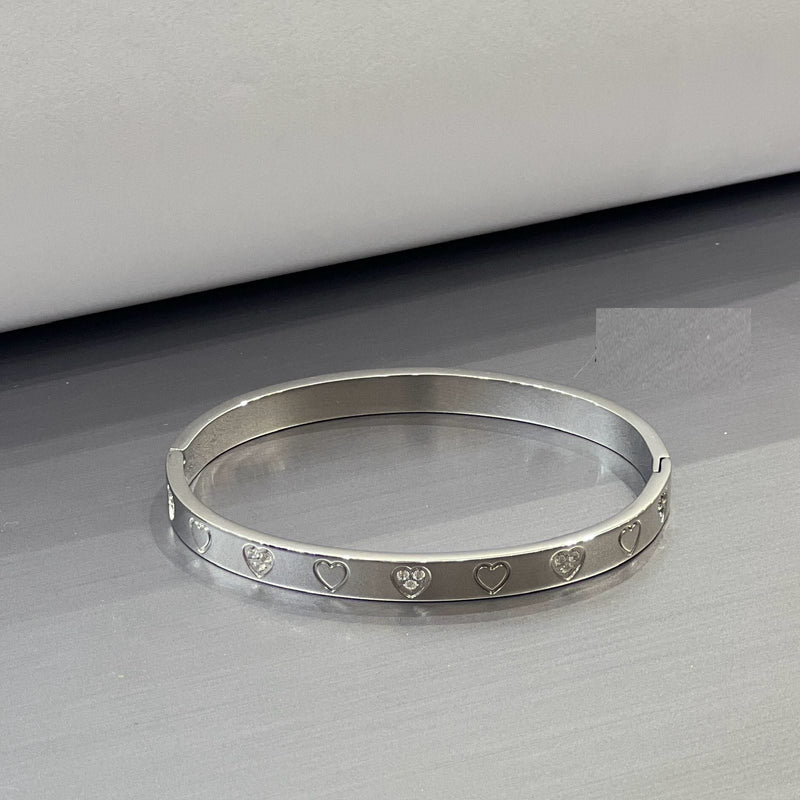 Heart Engraved Silver Bangle